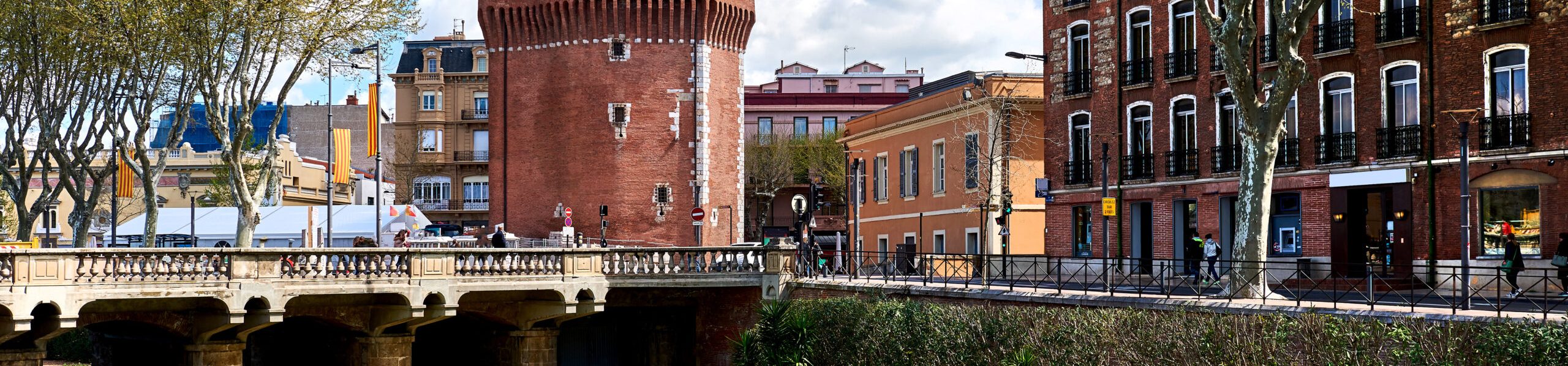 View,To,The,Canal,And,Castle,Of,Perpignan,In,Springtime.